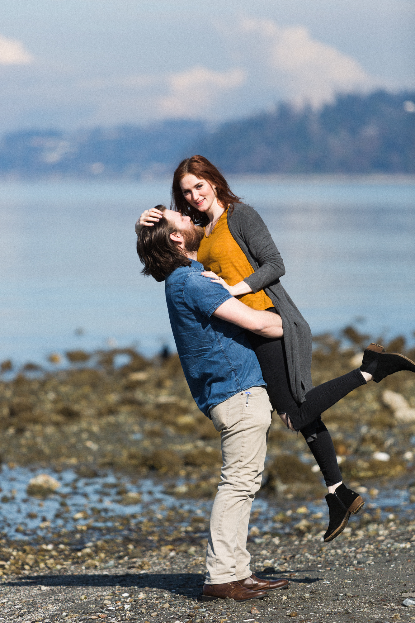 candid beach engagement session